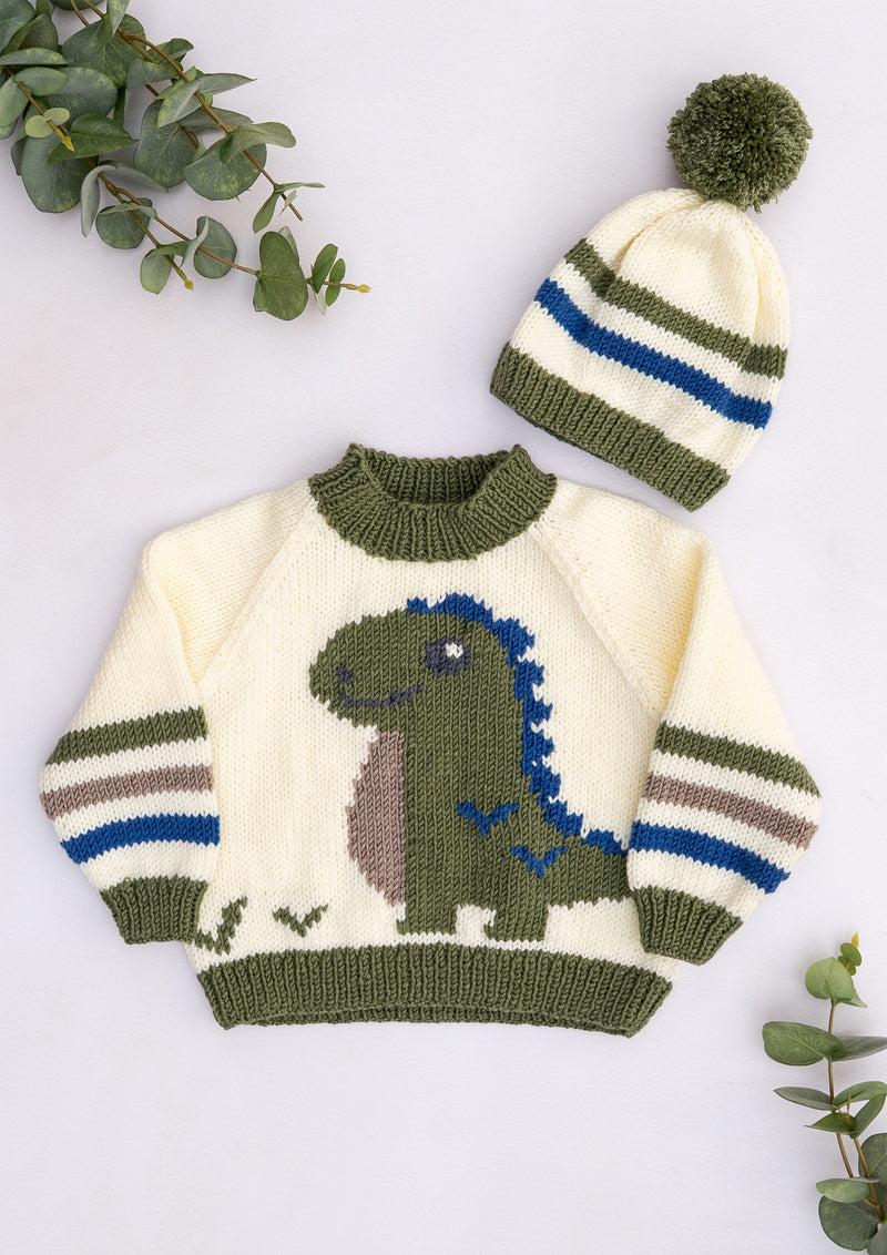 Children's knitted dinosaur jumper with green dinosaur motif, striped sleeves and matching olive green and blue pompom hat, from Lardedar Originals.
