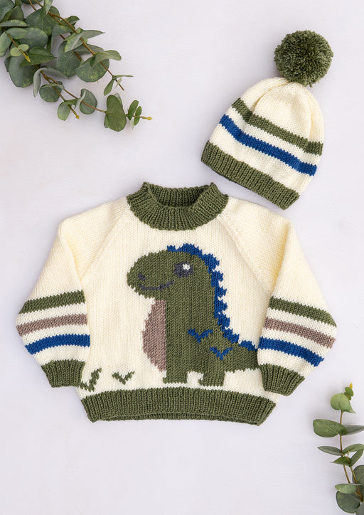 Children's knitted dinosaur jumper with green dinosaur motif, striped sleeves and matching olive green and blue pompom hat, from Lardedar Originals.